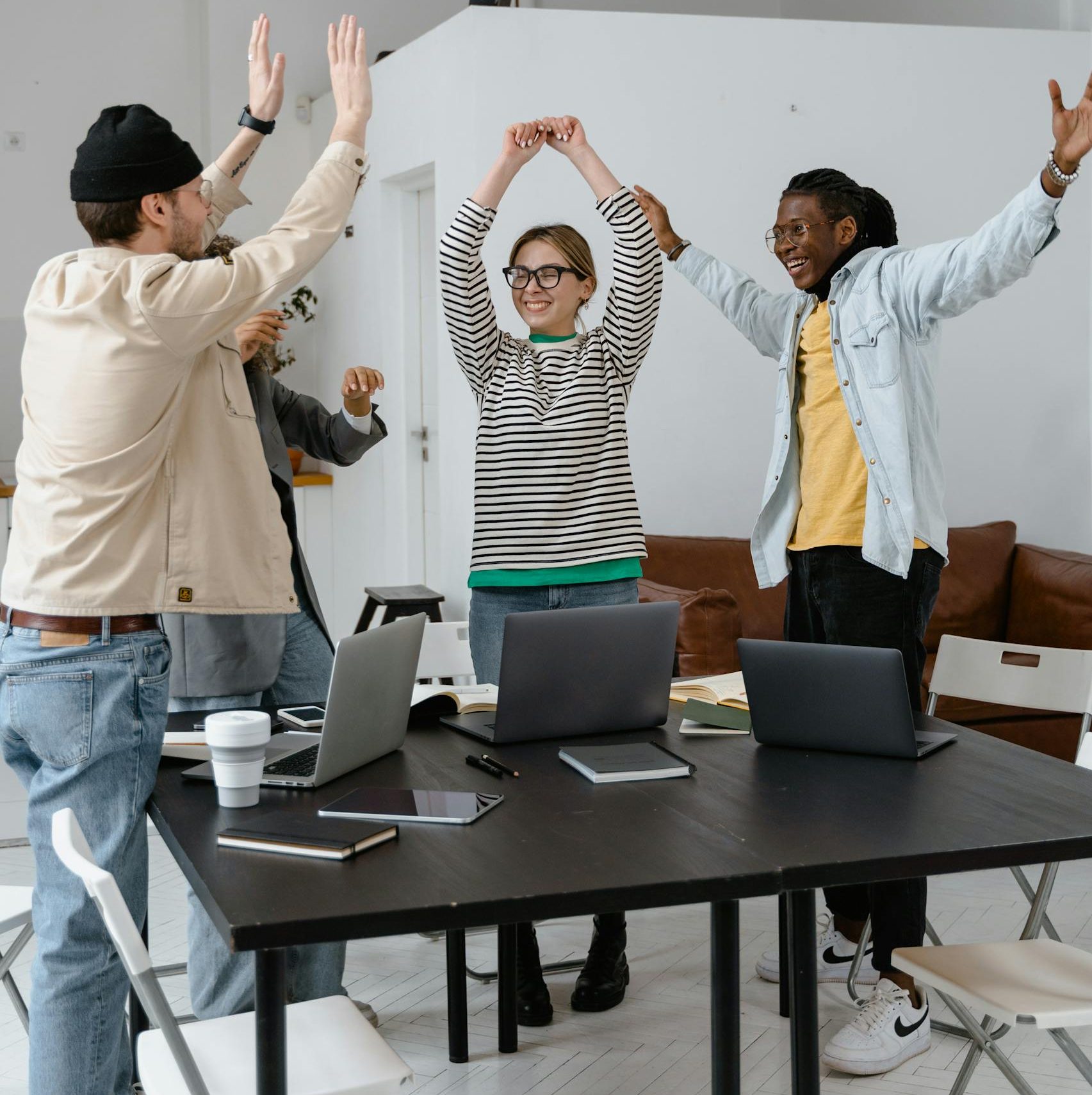 A Group of People Celebrating Together at Work