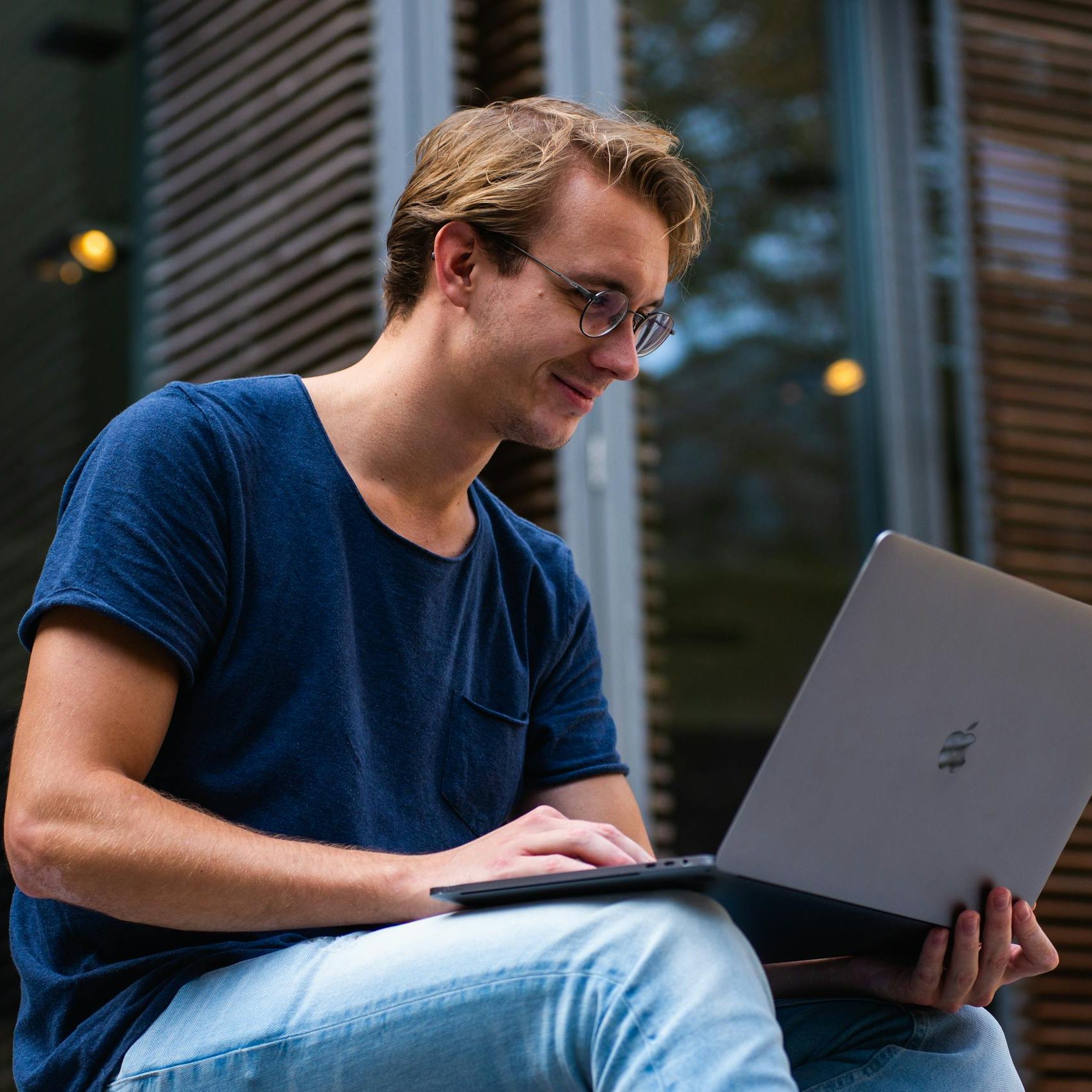 Selective Focus Photo of Man Using Laptop