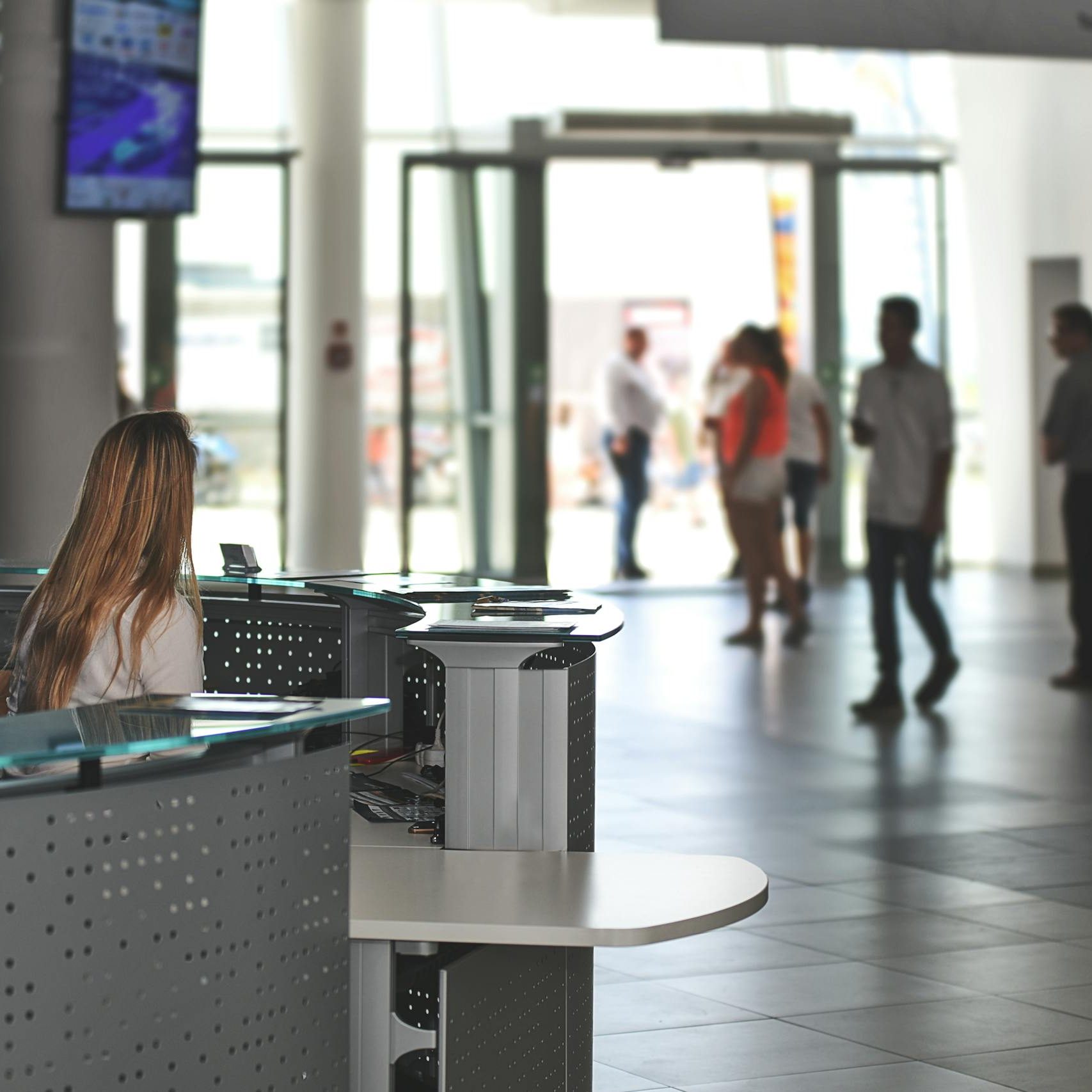 White Sitting Behind Counter Under Television